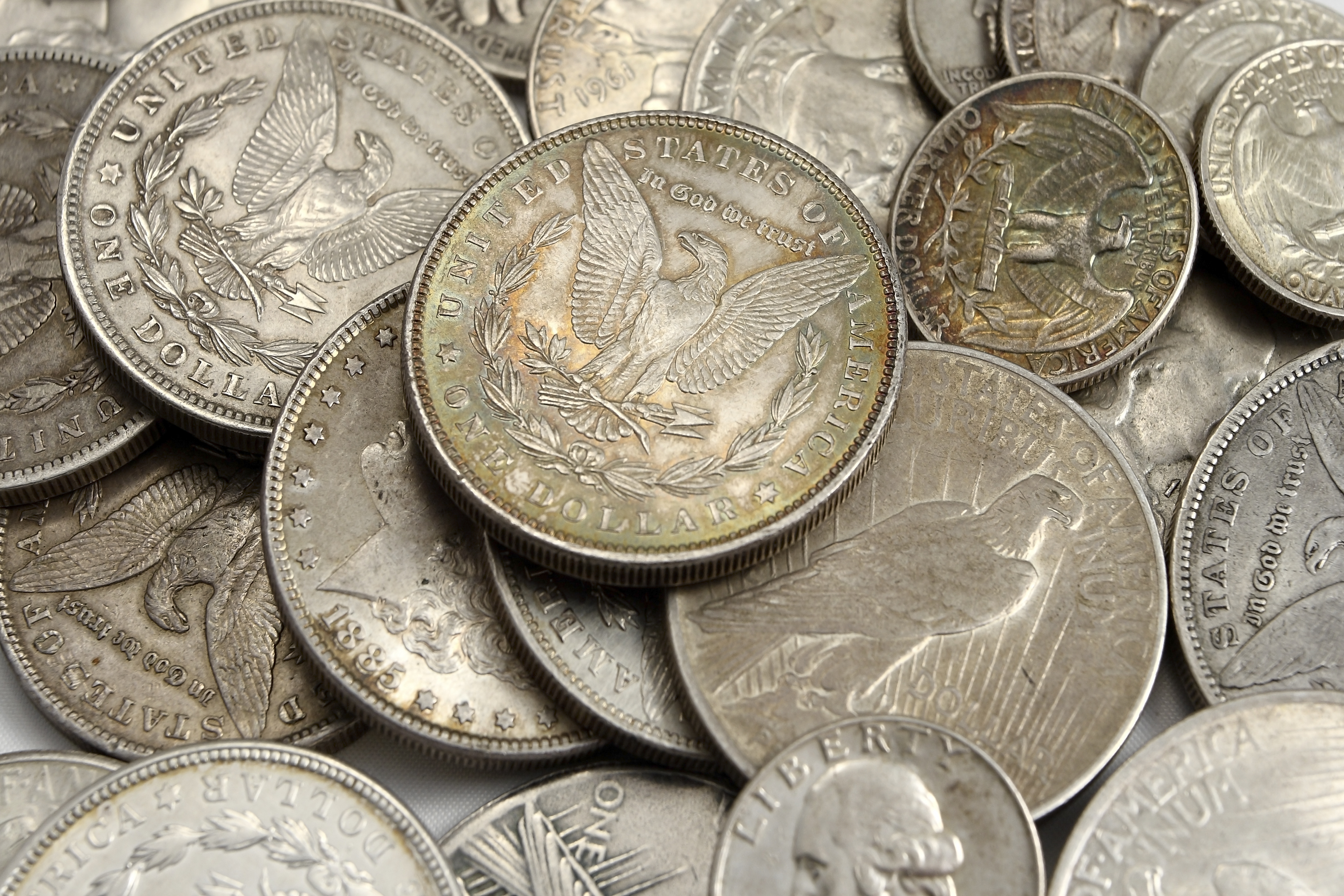 Detailed close-up of an assorted pile of pennies, highlighting the diversity in wear and patina of each coin.