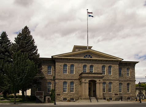 The Carson City Mint building as a historical landmark, emphasizing its role in minting some of the most collectible U.S. coins.