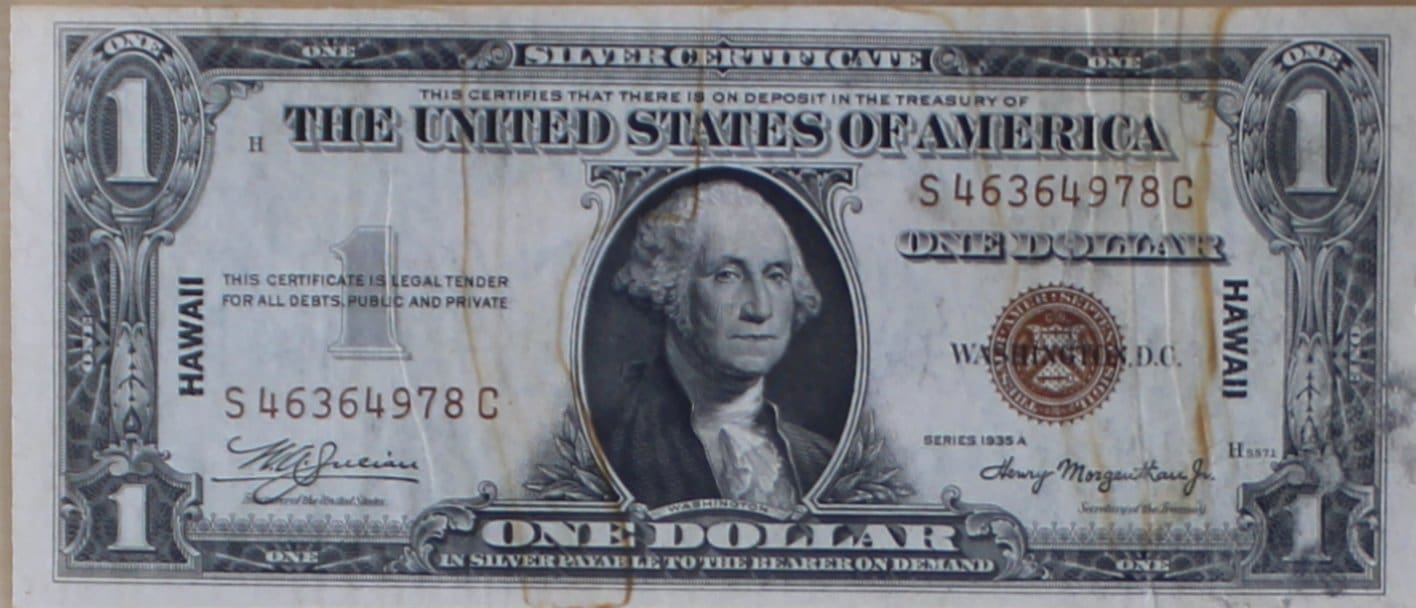 Valuable one-dollar bills front view, featuring detailed engravings and the portrait of George Washington.